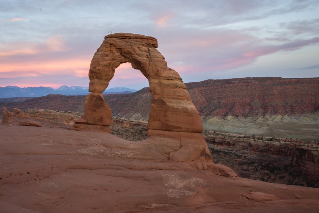 Breathtaking image of the Delicate Arch set against a vibrant sunset in Utah.